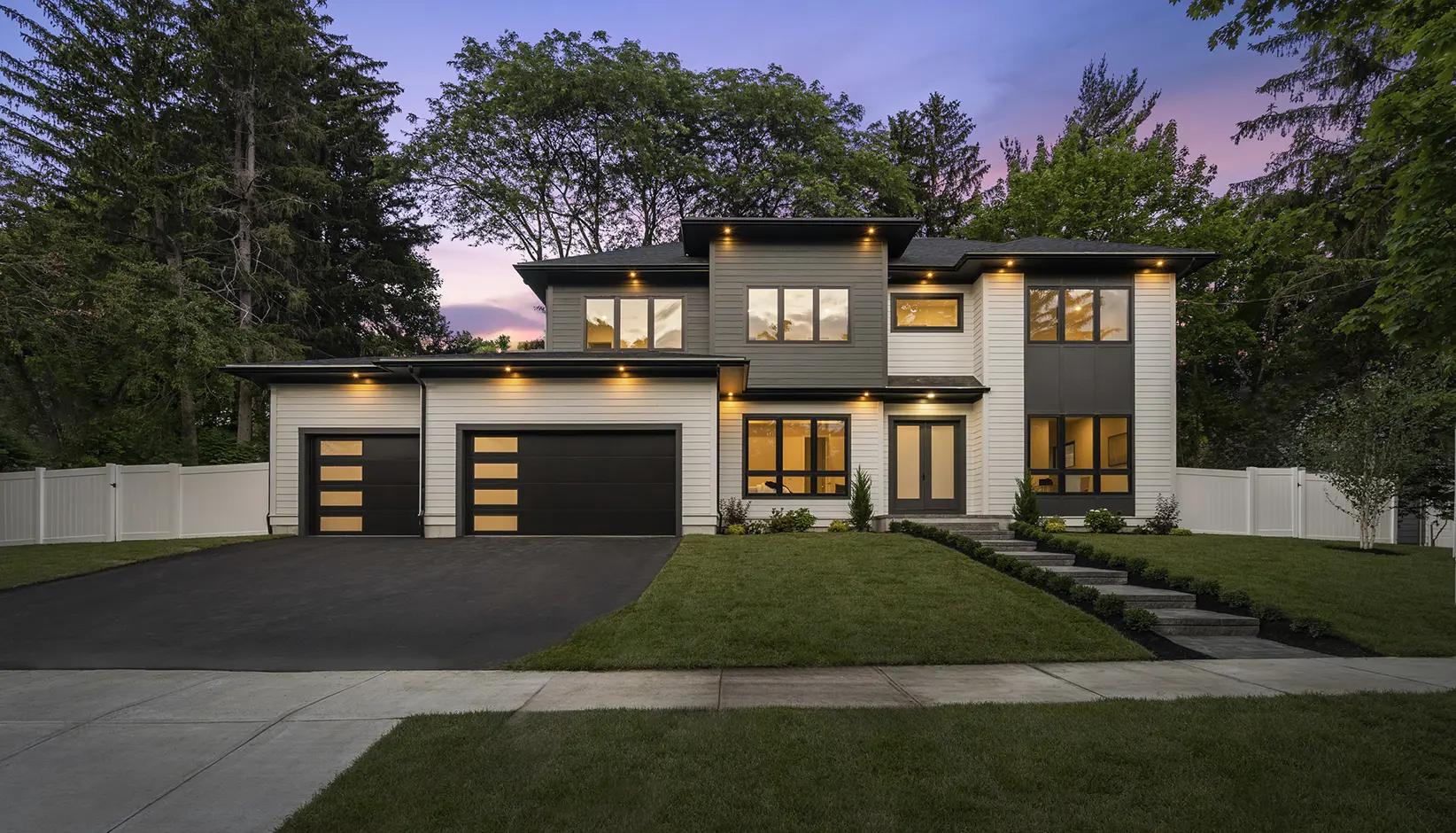Flush modern panel garage doors on a contemporary home